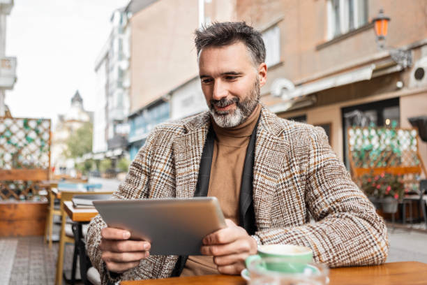 istock Businessman Working on Tablet Outdoors 2185573390