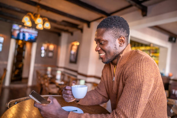 istock Young man enjoys his moment with coffee in the cafeteria 2185575217