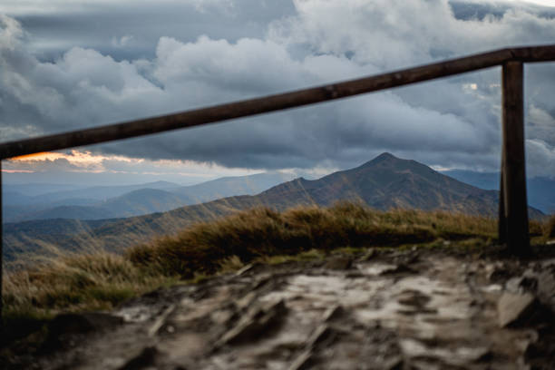 A frosty morning in the Bieszczady Mountains, with dramatic storm clouds and breathtaking views of Carynska and Wetlinska meadows.