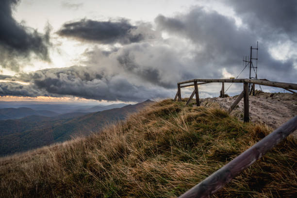 A frosty morning in the Bieszczady Mountains, with dramatic storm clouds and breathtaking views of Carynska and Wetlinska meadows.