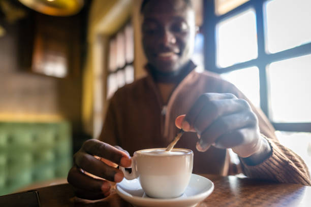 istock Afro-american man drinking coffee in cafe 2185575536