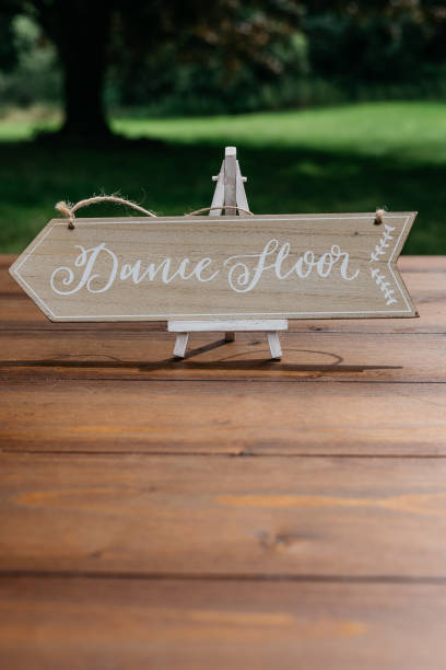 istock Wooden Dance Floor Direction Sign at Wedding Reception 2185577703