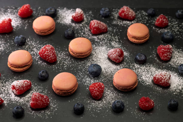 istock macaroons of different colors on a black background 2185578139