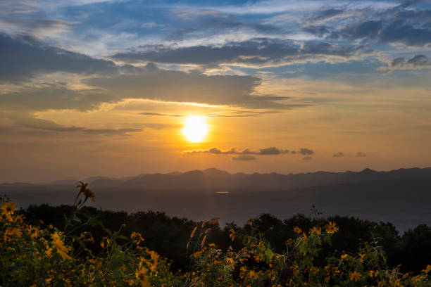istock sunset over a mountain with colorful orange clouds background 2185578466