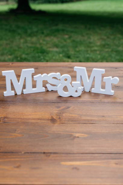 istock White Mrs and Mr Letters Wedding Decoration on Wooden Table 2185578768
