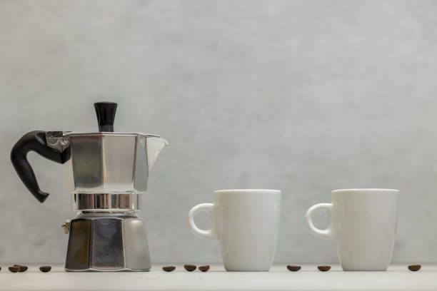 istock Metal geyser coffee maker on table with cup 2185580154
