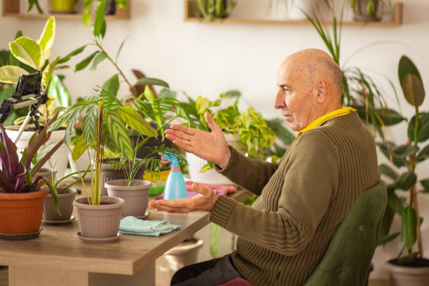 istock Retired Gentleman Sharing Houseplant Knowledge 2185581291