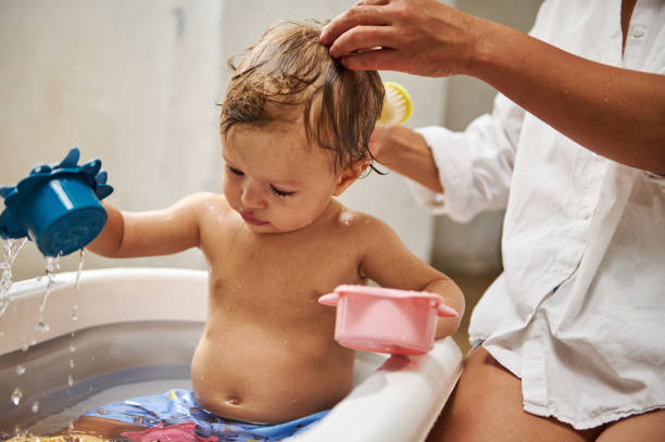 istock Adorable toddler playing with bath toys during bath time 2185582292
