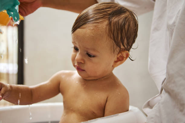 istock Adorable toddler enjoying a playful bath time experience 2185582332
