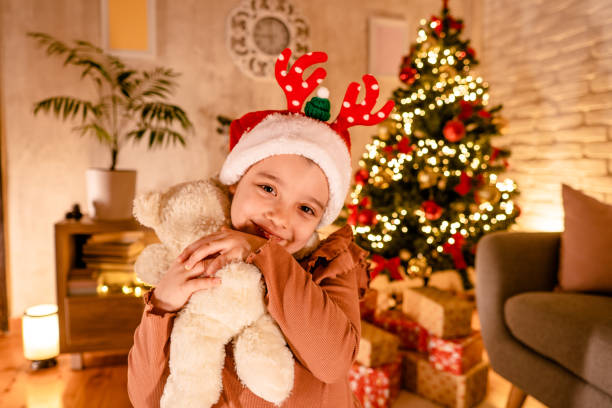 happy girl for christmas - くま ぬいぐるみ ストックフォトと画像