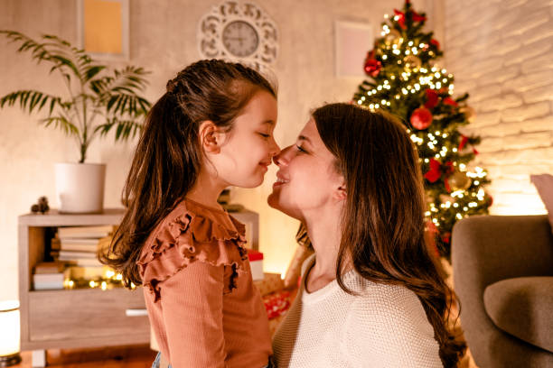 istock Mom hugs her daughter for Christmas 2185584028