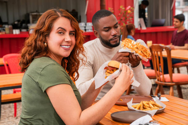 istock Couple eating at a fast food restaurant 2185584067