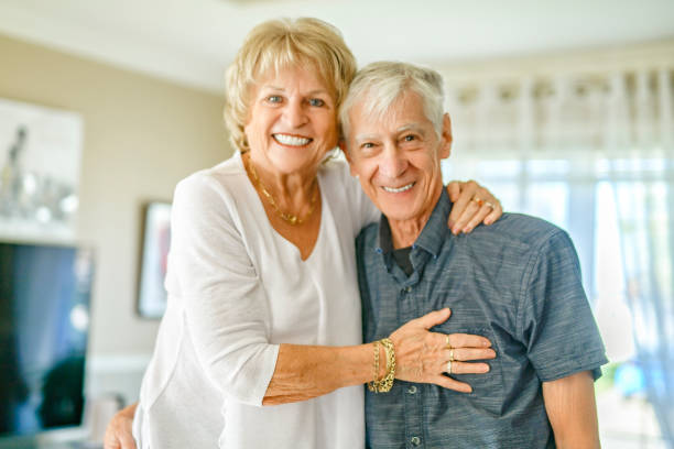 istock elderly 80s couple embracing each other at home 2185584539