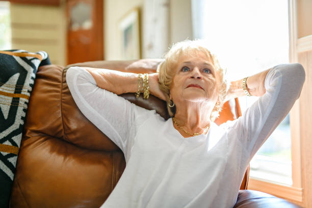 istock senior lady posing at home portrait close to a window 2185584544