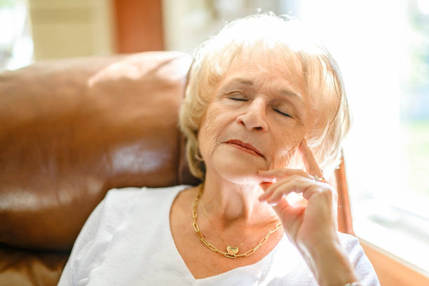 istock senior lady posing at home portrait close to a window 2185584551