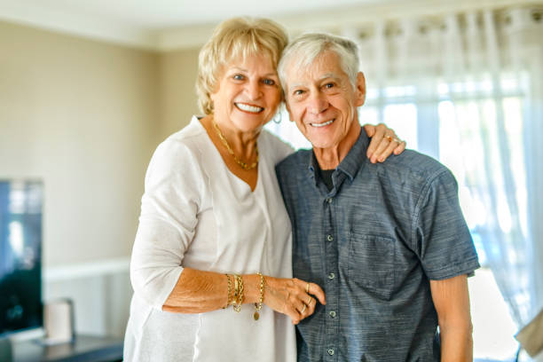 istock elderly 80s couple embracing each other at home 2185584555