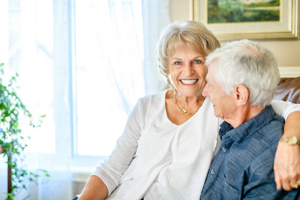 istock elderly 80s couple embracing each other at home 2185584571