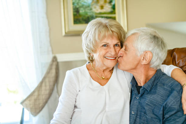 istock elderly 80s couple embracing each other at home 2185584573