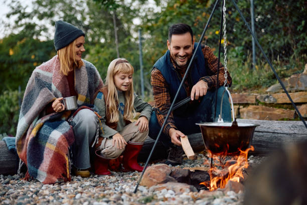 istock Happy family enjoying in camping weekend in nature. 2185584876