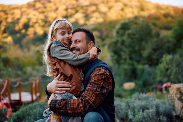 istock Happy father and daughter embracing in nature. 2185584988
