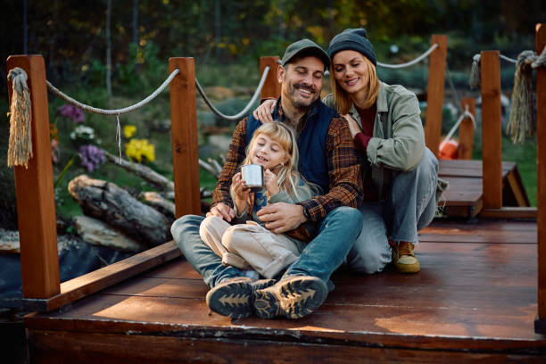 istock Loving family enjoying while relaxing on a pier in nature. 2185585128