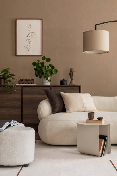 istock A refined living space featuring minimalist decor, a cozy sofa, and lush plants. The perfect combination of modern design and natural accents for a serene environment. 2185585158