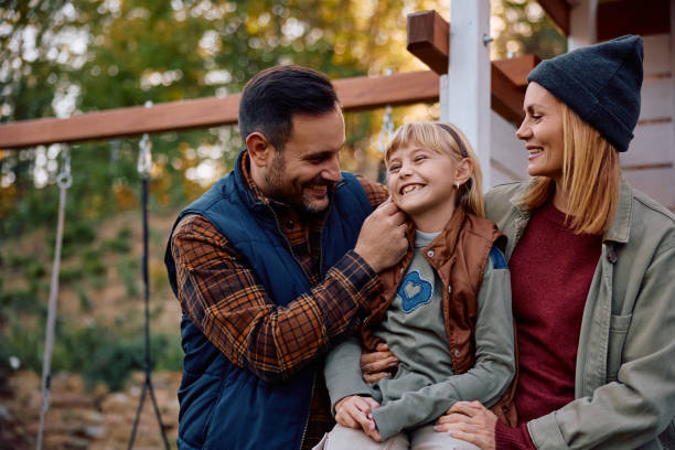istock Happy family having fun while spending a day outdoors. 2185585360