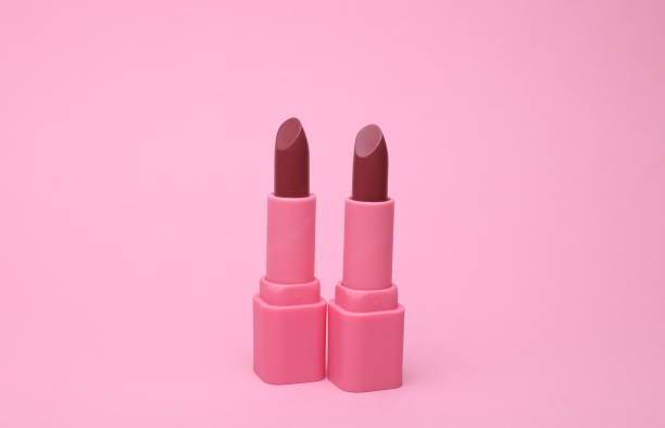istock Pink lipstick tubes on pink background 2185588888