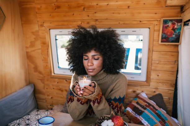 istock Girl blowing out a candle at Christmas 2185589099