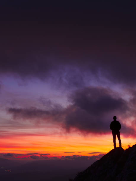 istock Man at sunset. Sky at sunset in San Miguel de Aralar, Navarra. 2185589138