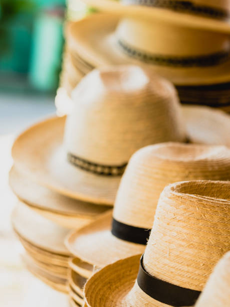istock Stacks of Straw Hats Displayed for Sale in Cuba 2185592673