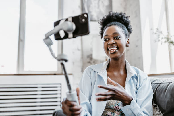 istock Confident Black Woman Vlogging with Smartphone at Home 2185594797