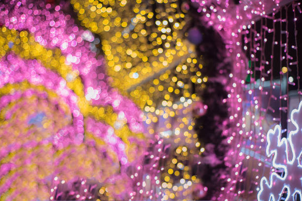 glowing colorful Christmas lights on black background, overlay