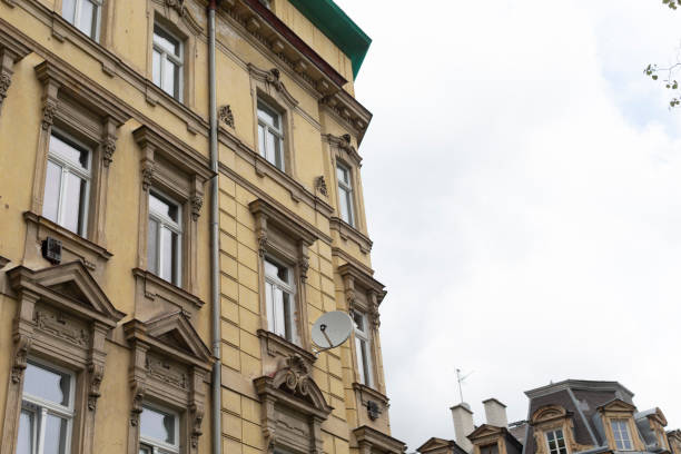 istock Elegant Historic Building with Satellite Dish in Urban Setting 2185595948