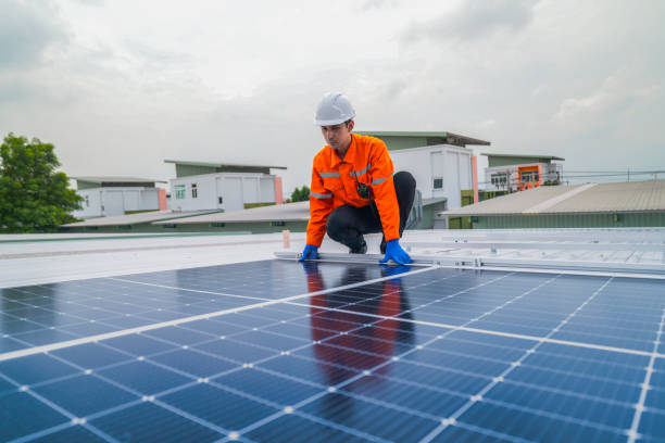 istock close up on grid of technology renewable solar energy. construction solar panels system on roof. Installing solar photovoltaic panel system. background of blue of solar cell system and structure roof. 2185596169