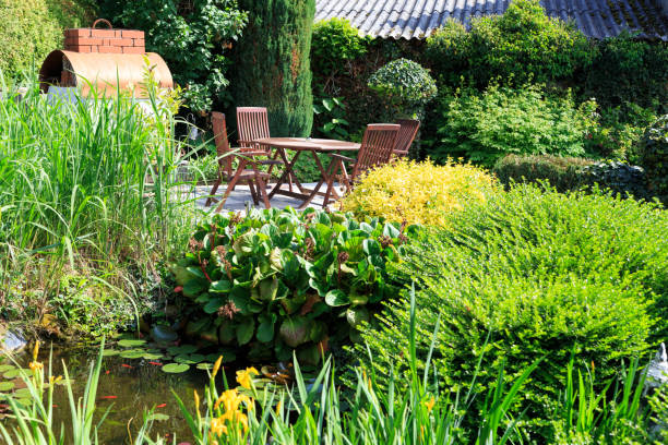 istock Sitting area in the garden with pond 2185599102