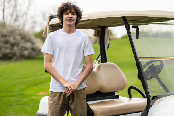 istock Confident young golfer near the golf cart looking determined 2185599518