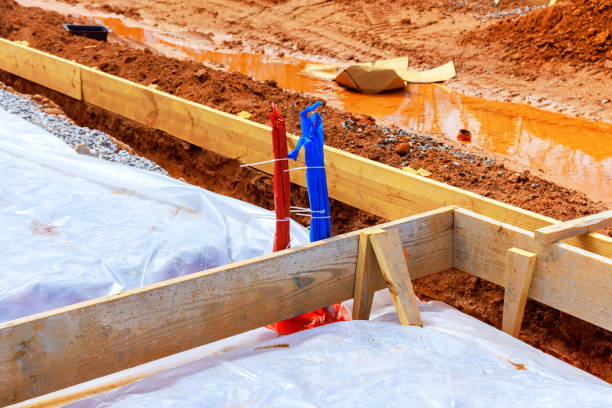 istock Construction site showing wooden framing plastic boundaries during preparation foundation 2185599847
