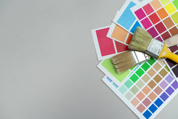 istock brushes on a palette color guide, renovation concept.  Color catalog for tinting facade a 2185602553