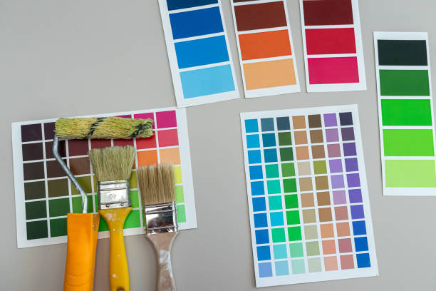 istock brushes on a palette color guide, renovation concept.  Color catalog for tinting facade a 2185603047