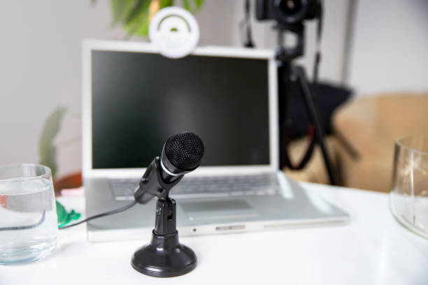 Microphone connection with Laptop and light equipment for freelance work podcasting, online streaming, radio broadcasting. Copy space