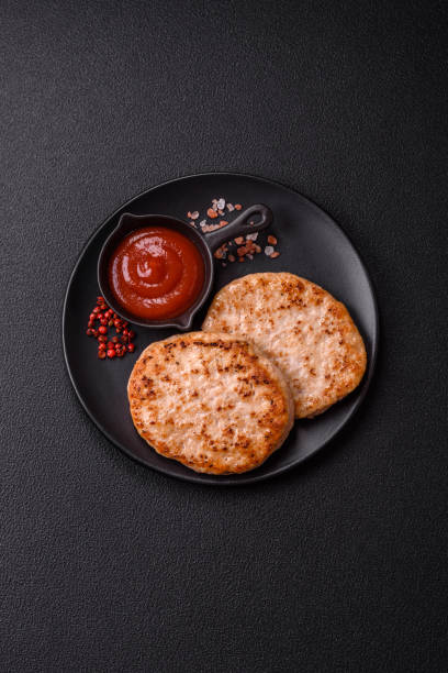 istock Grilled chicken burger cutlet with salt, spices and herbs 2185608385