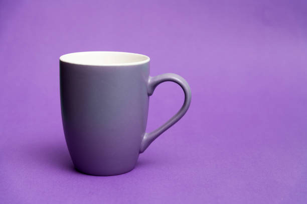 Purple mug on purple background.