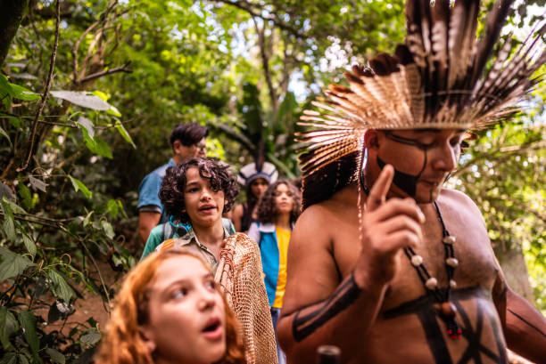 istock Kids during a hike with an indigenous man through the forest 2185608891