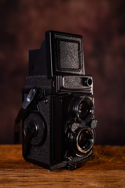 istock old vintage medium format film photo camera on a dark background 2185609361