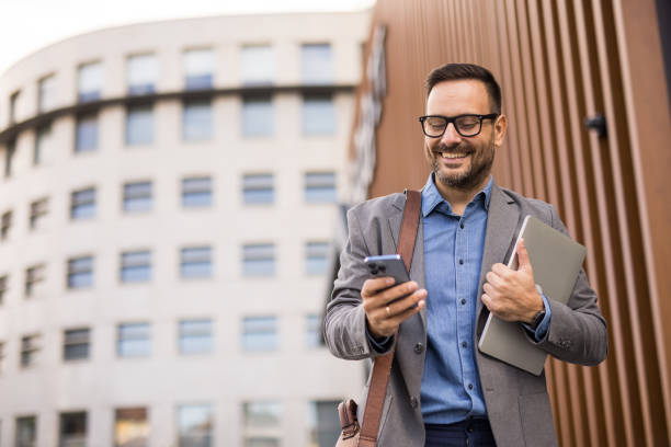 istock Businessman with laptop and smartphone in hand 2185612277