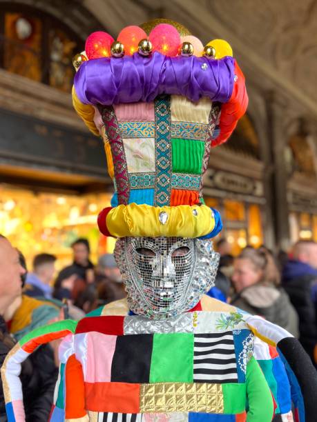 Tourists enjoying wearing costumes in Venice Carnival, Italy Venice, Italy - February 10, 2024: A person wearing a modern costume around San Marco square at the fist day of Venice's Carnival. mardi gras body painting stock pictures, royalty-free photos & images