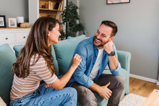 istock Young couple enjoying together at home 2185613176