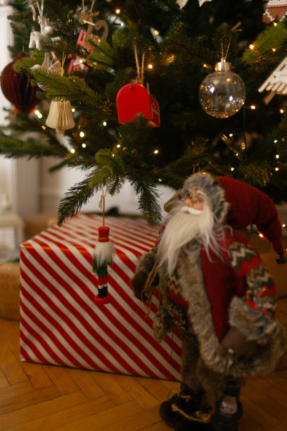 istock Santa Claus is standing next to Christmas tree 2185613376