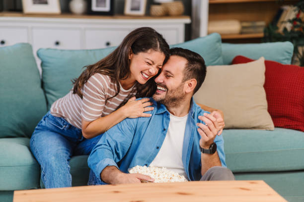 istock Young couple enjoying together at home 2185613461